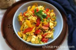 The method of stir frying eggs with colored peppers