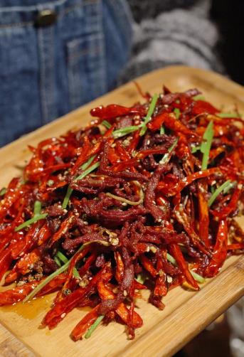 The method of stir frying shredded beef