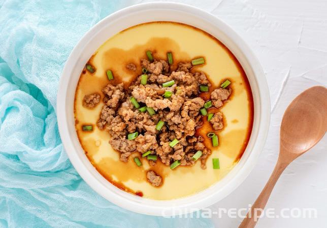 The method of steaming tofu with minced meat and eggs