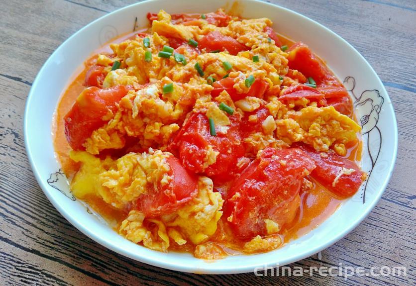 The method of stir frying eggs with tomatoes