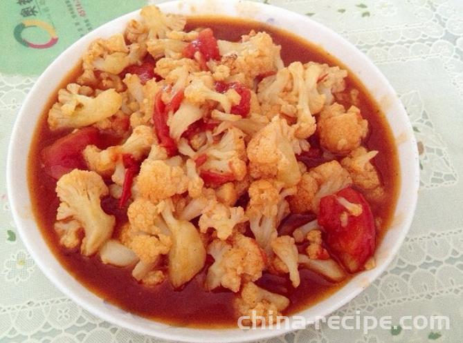 The method of stir frying cauliflower with tomatoes