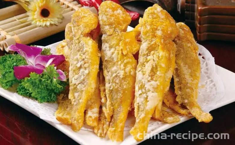 The recipe for frying yellow croaker with snow vegetables