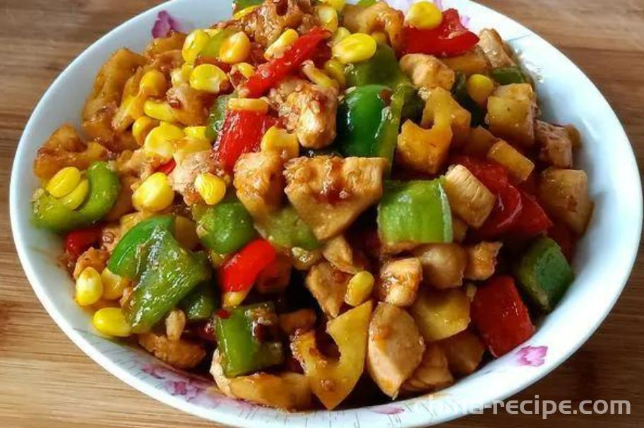 The method of stir frying diced chicken with colored peppers